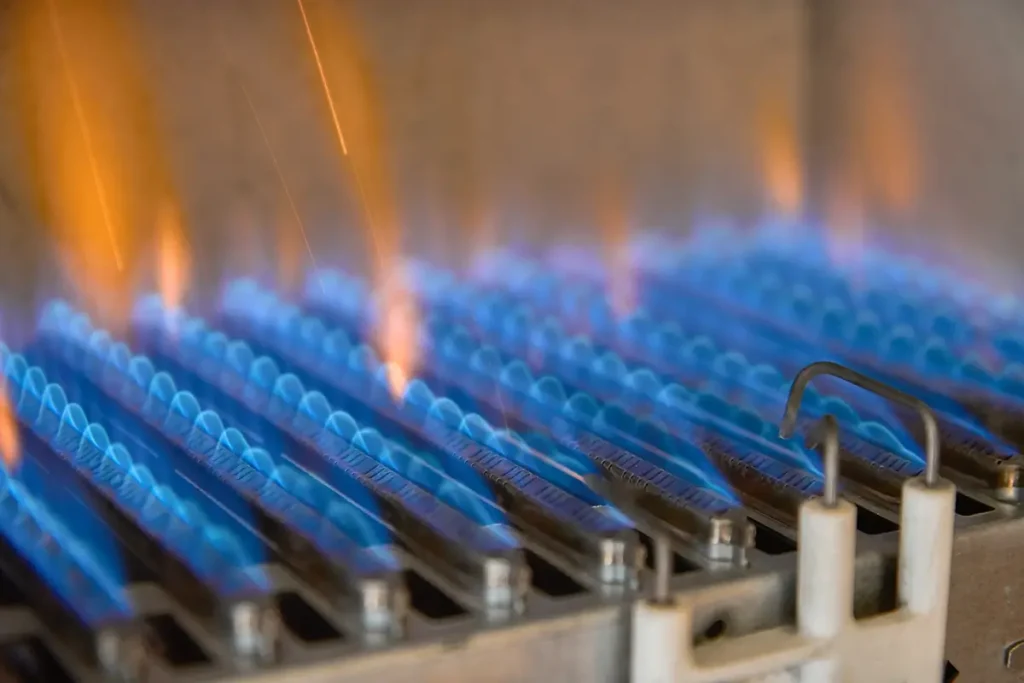 A close up image of an ignitor inside an HVAC system